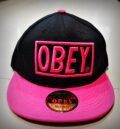 Черна дамска шапка с права козирка OBEY с розова релефна бродерия
