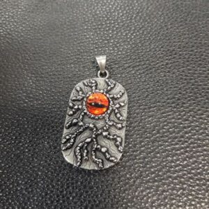 Медальон плочка от стомана с червено око
