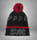 Мъжка зимна шапка AC/DC в черно и червено с помпон и светкавици